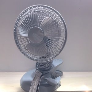 Small, gray desk fan. Great at cooling you down.